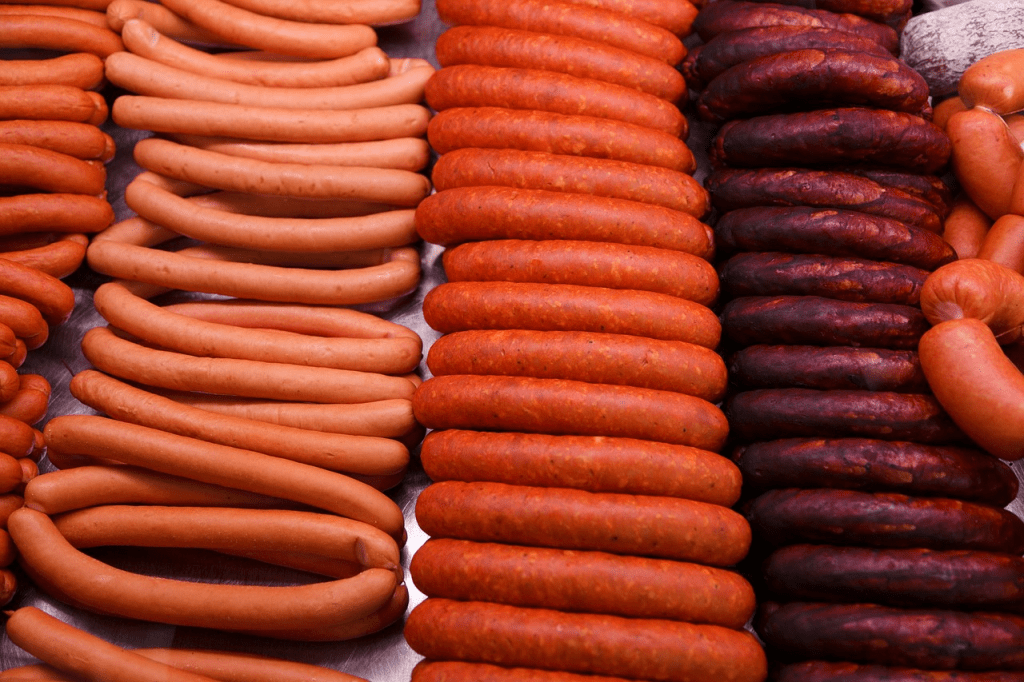 5 types of sausages lined up in the butcher's window