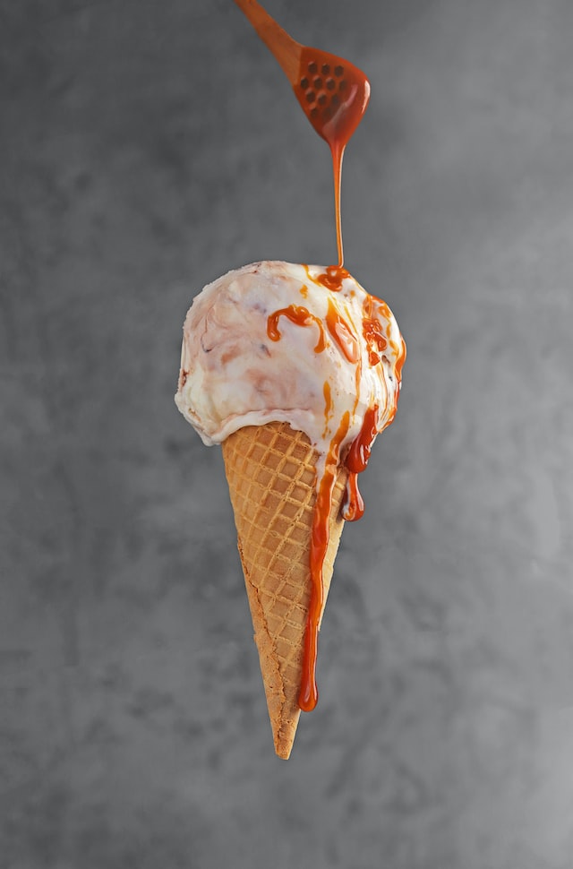 Ice Cream with salted caramel sauce in a cone