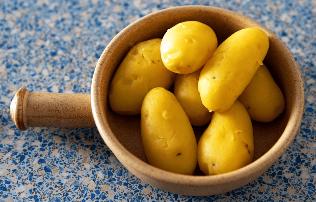 cooked potatoes in a ceramic bowl