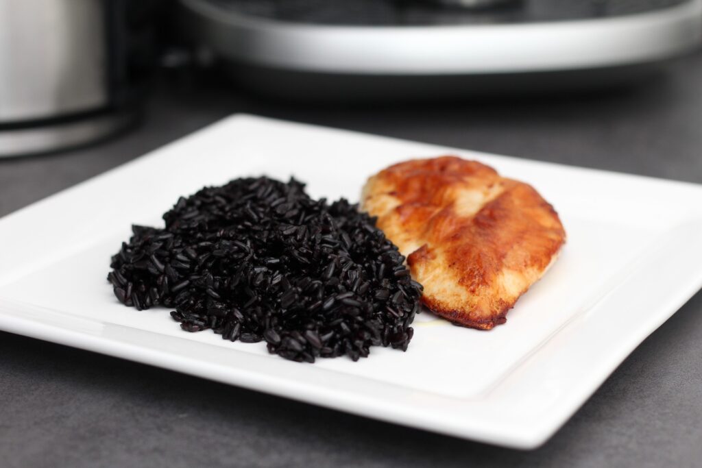 black rice on a white plate
