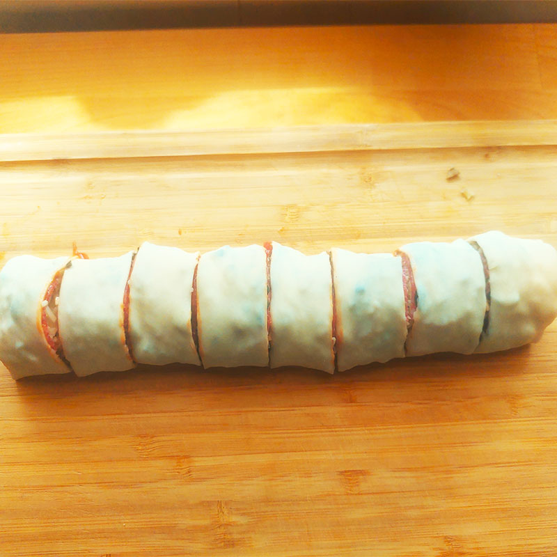 cut the rolled up dough and contents into 1.5 cm pieces